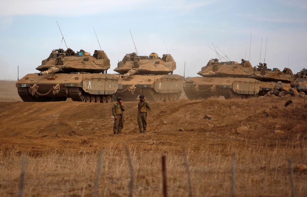 A picture taken on Nov. 20, 2017, shows Israeli Merkava Mk-IV tanks taking part in a military exercise near the border with Syria in the Israeli-occupied Golan Heights. Photo: Jalaa Marey/AFP/Getty Images